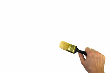 Hand holding painting brush on white background.