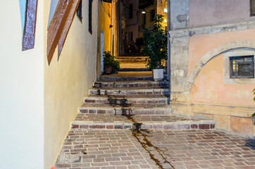 Traditional Alleys with Stairs in the Old Historic Town of Chania, Crete Island, Greece. Beautiful Streets at Night.