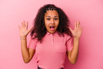 Young african american woman isolated on pink background screaming to the sky, looking up, frustrated.