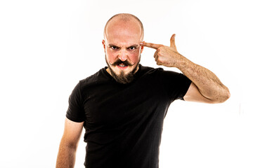 The man dressed in a black shirt poses in a photo studio.