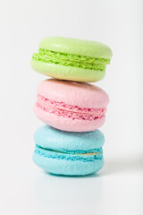 Colorful cake macaroons on a light background