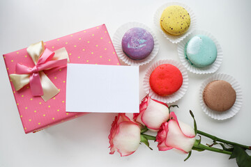 sweet dessert. macarons, gift box and a bouquet of flowers. 