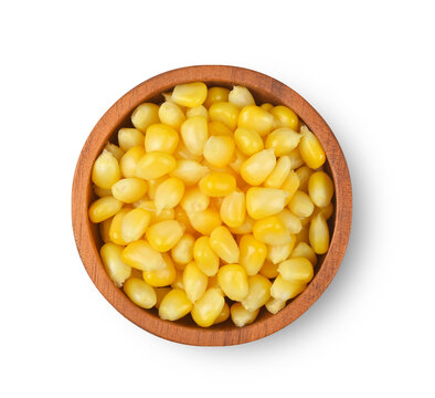 Corn, Heap of canned yellow sweet corn seeds isolated on white background. Top view