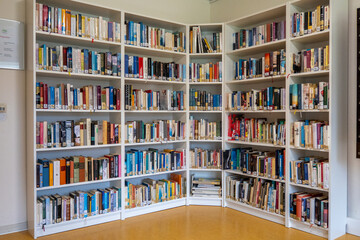 in the library there are many books on the shelves