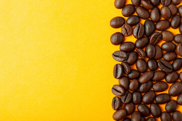 Roasted coffee beans on the color background for wallpaper or decor