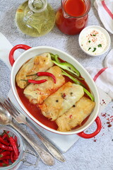 Cabbage rolls with minced meat on a gray background