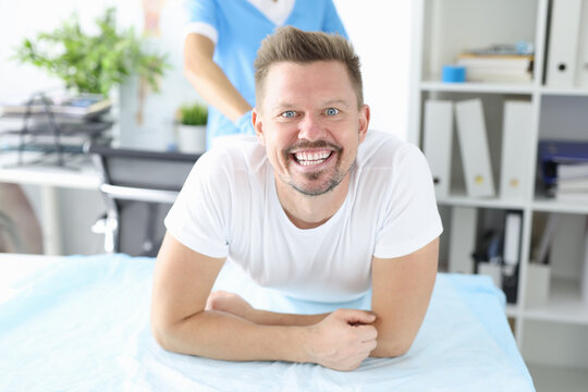 Portrait of smiling man at proctologist appointment