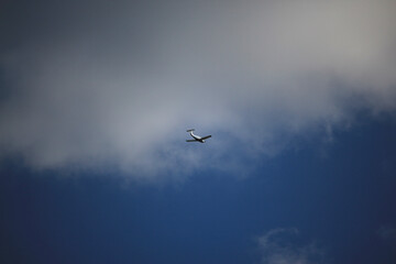 Clear blue skies with passengers being flown through it