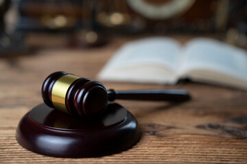 Obraz premium Law theme. Lawyers office. Gavel on the rustic brown desk. 