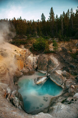 Smoke rising from the Crystal Blue Geysers at the Norris Porcelain Basin in Yellowstone National Park in Wyoming