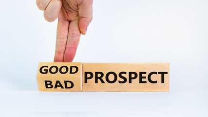 Good or bad prospect concept. Businessman turns a block and changes words 'bad prospect' to 'good prospect'. Beautiful white background. Business, good or bad prospect concept. Copy space.