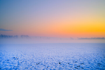 Sunset in a park with snow