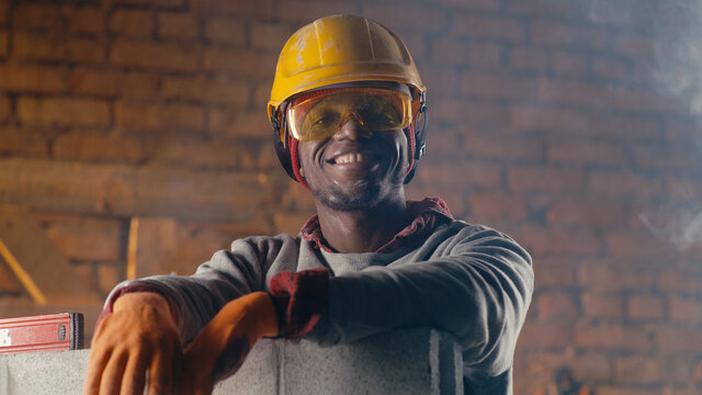 Cheerful Black Man On Construction Site