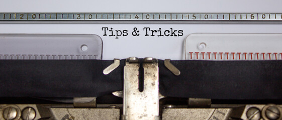 Tips and tricks symbol. Words Tips and tricks typed on retro typewriter. Business, tips and tricks...