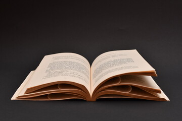 Amazing open old book on black background