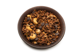 Chocolate granola cereal with nuts in a bowl background.