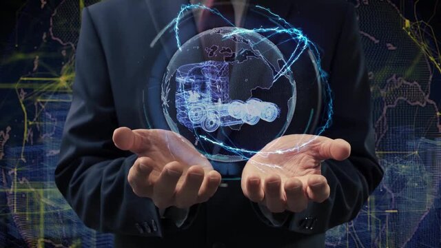 Male hands activate a conceptual holographic modern EURO TIR Truck. Businessman in a suit with a hologram of planet Earth on a background of a futuristic wireframe city