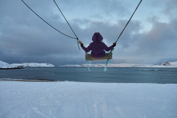 Beautiful woman with cup of tea on Swing. River on background, nature and calm. Self isolation.