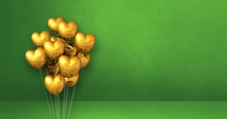 Gold heart shape balloons bunch on a green wall background. Horizontal banner.