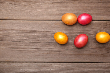 Obraz na płótnie Canvas Painted Easter Egg on the wooden background