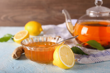 Tea, lemon, honey and ginger healthy on the light background