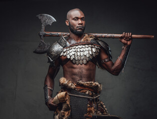 Warlike african man with axe wearing ancient fur and armour