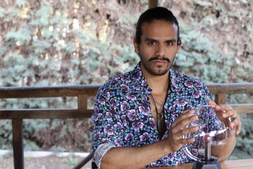 Fototapeta premium Handsome fortune teller with crystal ball 