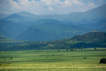 Fototapeta na wymiar Alpine landscape with village and field, Armenia