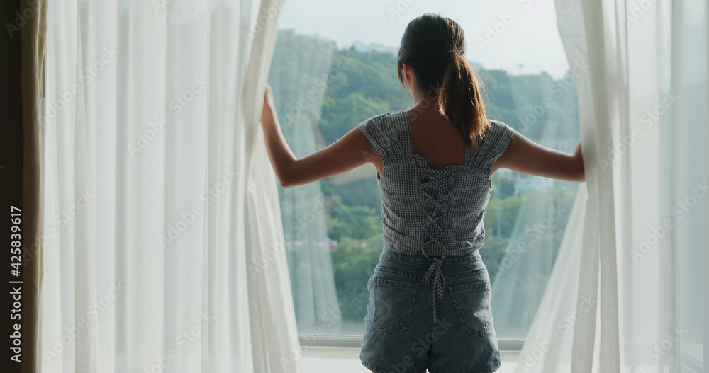 Poster woman open the curtain at room