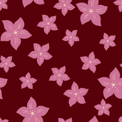 Seamless random pattern with pink colored tropic flowers shapes. Maroon background. Decorative artwork.