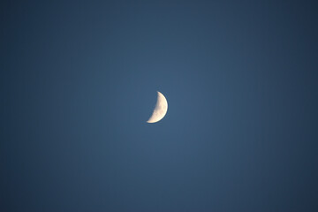 Obraz na płótnie Canvas Brightly shining moon in a cloudless night sky