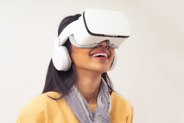 Portrait of Asian girl wearing virtual reality headset with big smile and excited, isolated on white background