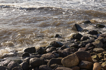 Rocky sea shore in windy weather.