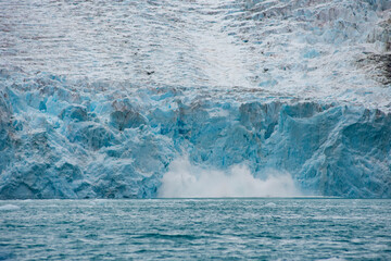 Snow Avalanche in mountains falling glacier in Chile fjords