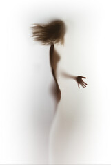 Beautiful and sexy, erotic woman body and blowing hair with hand, diffuse silhouette abstract.