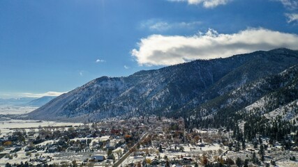 winter in the mountains drone aerial view of Genoa Nevada at the base of the Sierra