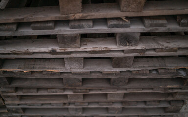 Fototapeta na wymiar Stacks of wooden shipping cargo pallet stack 