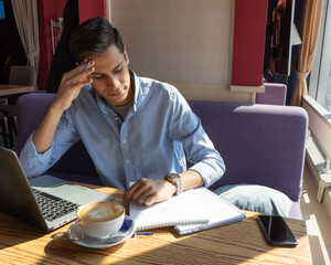 businessman ponders a solution while completing a biology project