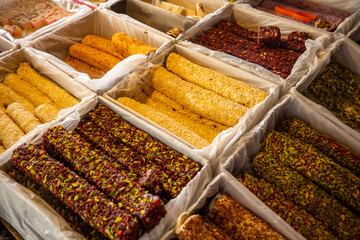 Sweet rolls made of nougat and nuts for sale in turkish market in Antalya, Turkey