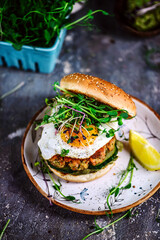 Fish burger with avocado sauce