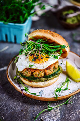 Fish burger with avocado sauce