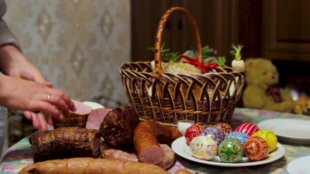 easter basket,mother prepares Easter basket on the table