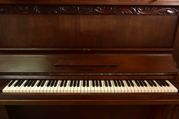 Fototapeta na wymiar Gorgeous antique upright piano over 100 years old.
