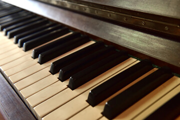 Fototapeta na wymiar Gorgeous antique upright piano over 100 years old.