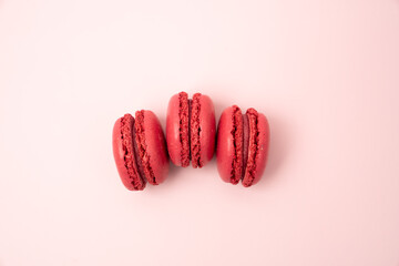 Bright pink French Macaron cookies on blush background