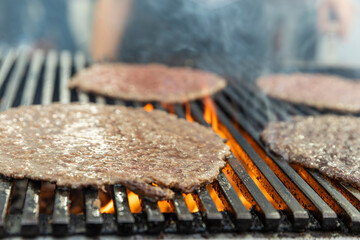 Raw grill meat being prepared.
