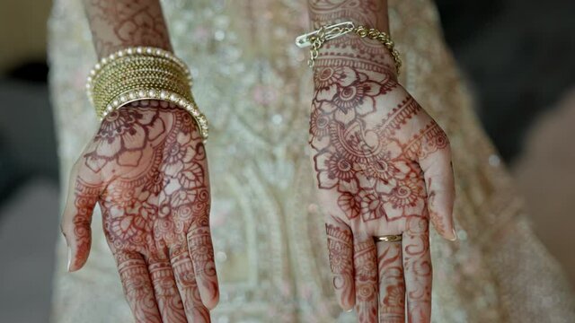 Hands Of An Arab Bride. She Holds Her Hands Palms Up. Hands Painted With Henna.