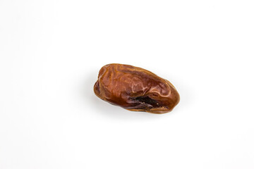 Date fruit. Fruit dates. One date isolated on a white background. Date close up, macro.