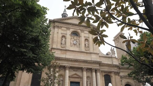 Sorbonne University with columns statues and clock in Paris