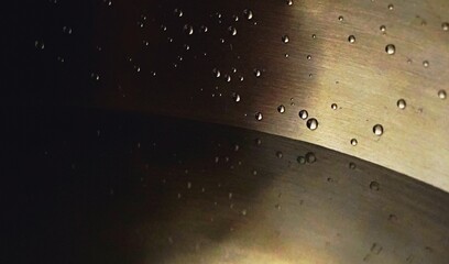 Water drops close up in a singing bowl